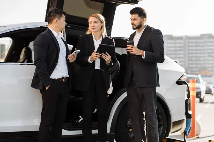 Three workers charging their Ev with Xova chargers